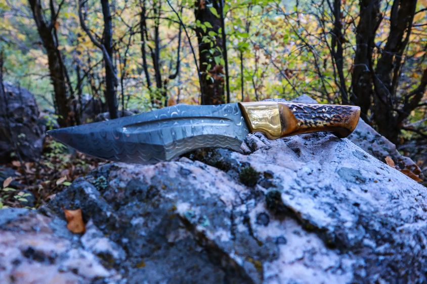 A knife on a rock Description automatically generated