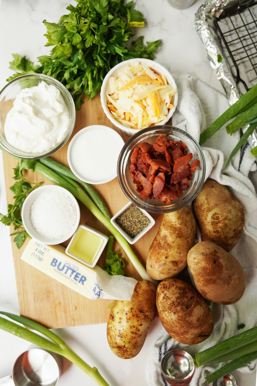 potatoes, scallions, cheese, butter, sour cream, buttermilk, chives, bacon