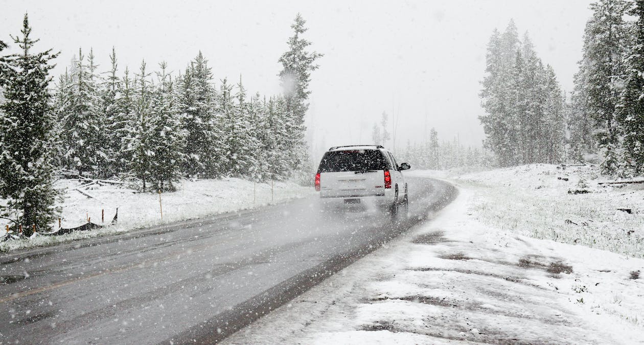 A car driving through heavy snow