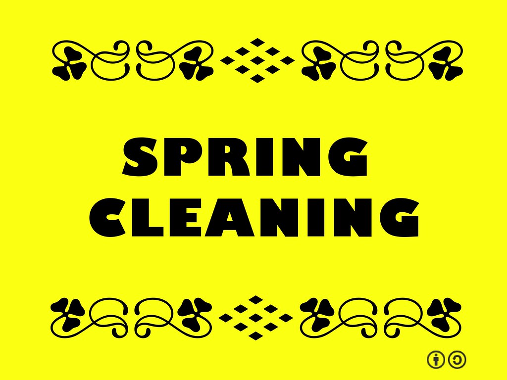 text of spring cleaning against a yellow background
