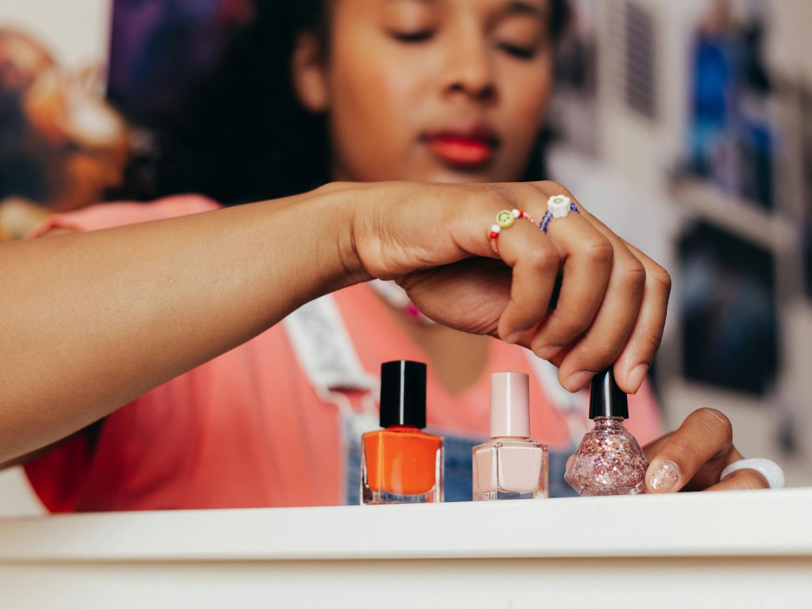 lady picking nail polish image