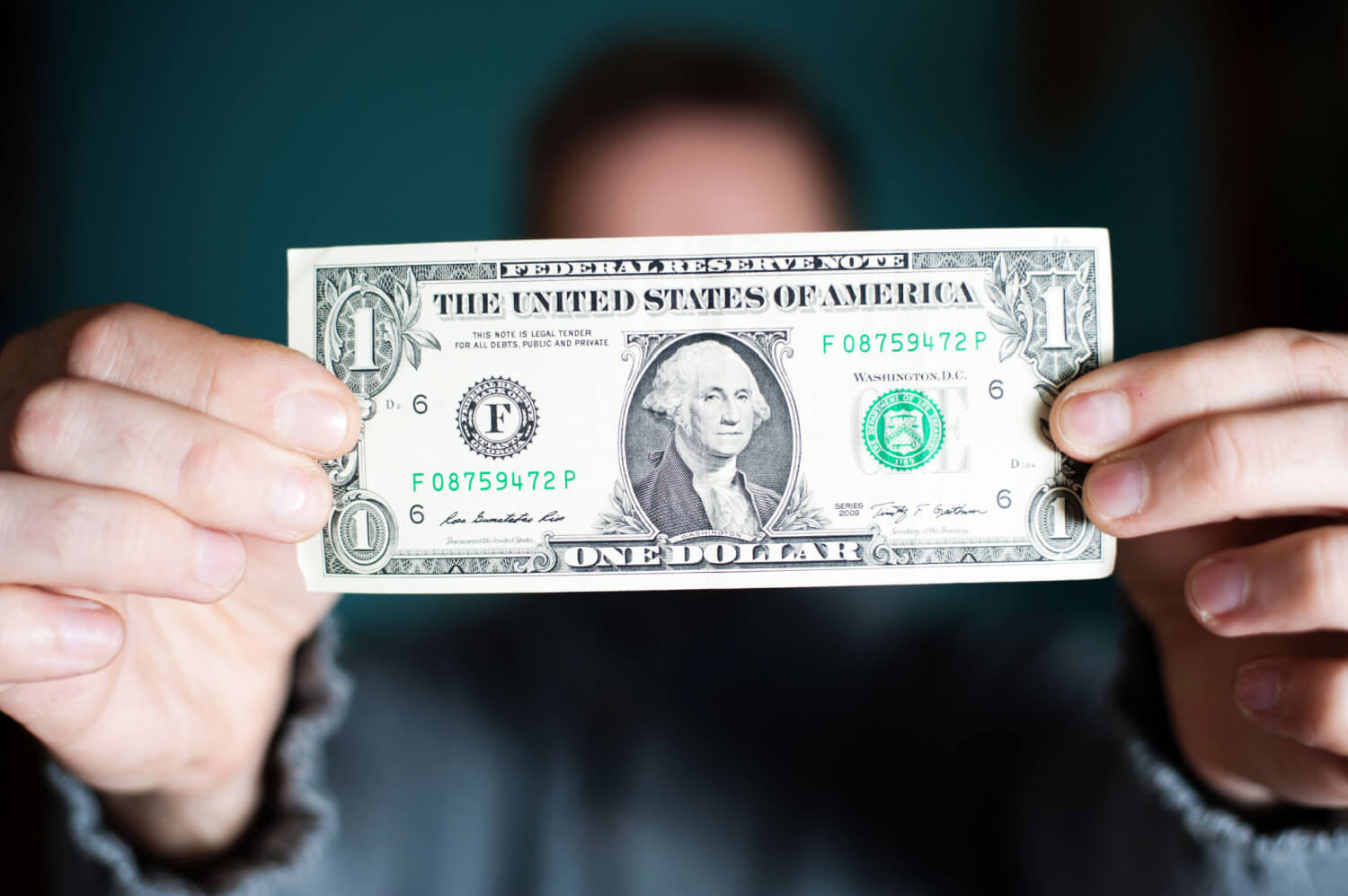 Man holding the American US dollar bill