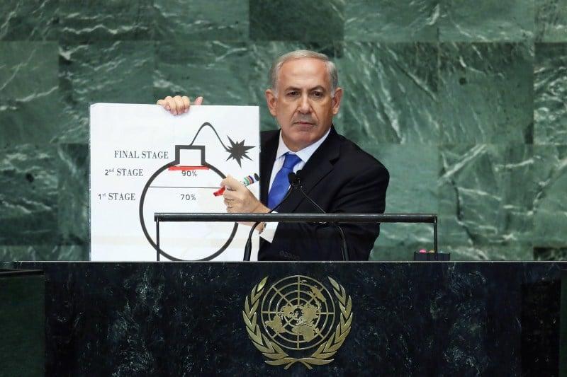 Israeli Prime Minister Benjamin Netanyahu pauses after drawing a red line on a graphic of a bomb while discussing Iran during an address to the United Nations General Assembly in New York City.