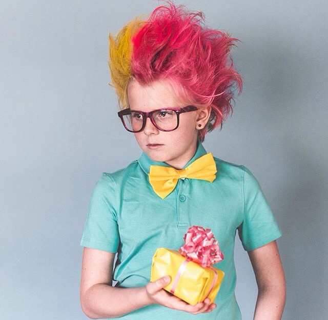 Picture of a boy rocking  the look of a crazy scientist for the event