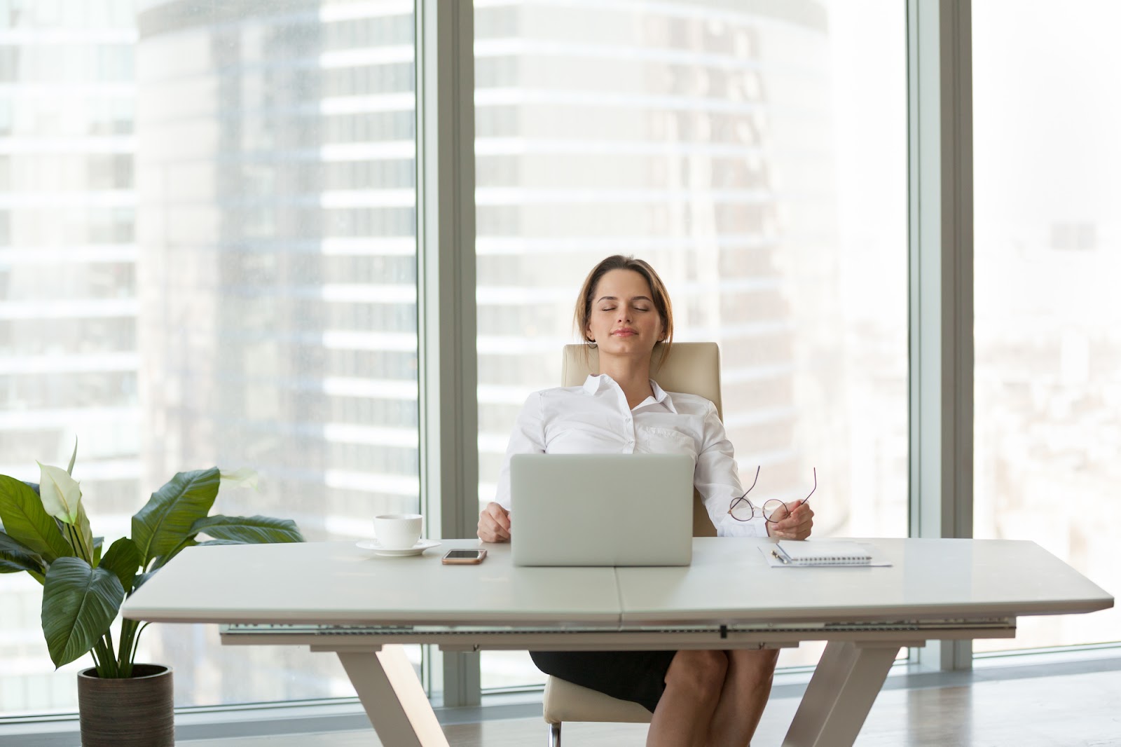 A women relaxing on a comfortable office chair