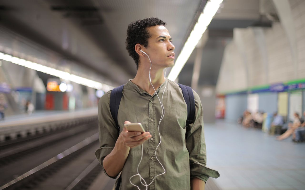 Man listening to music while travelling