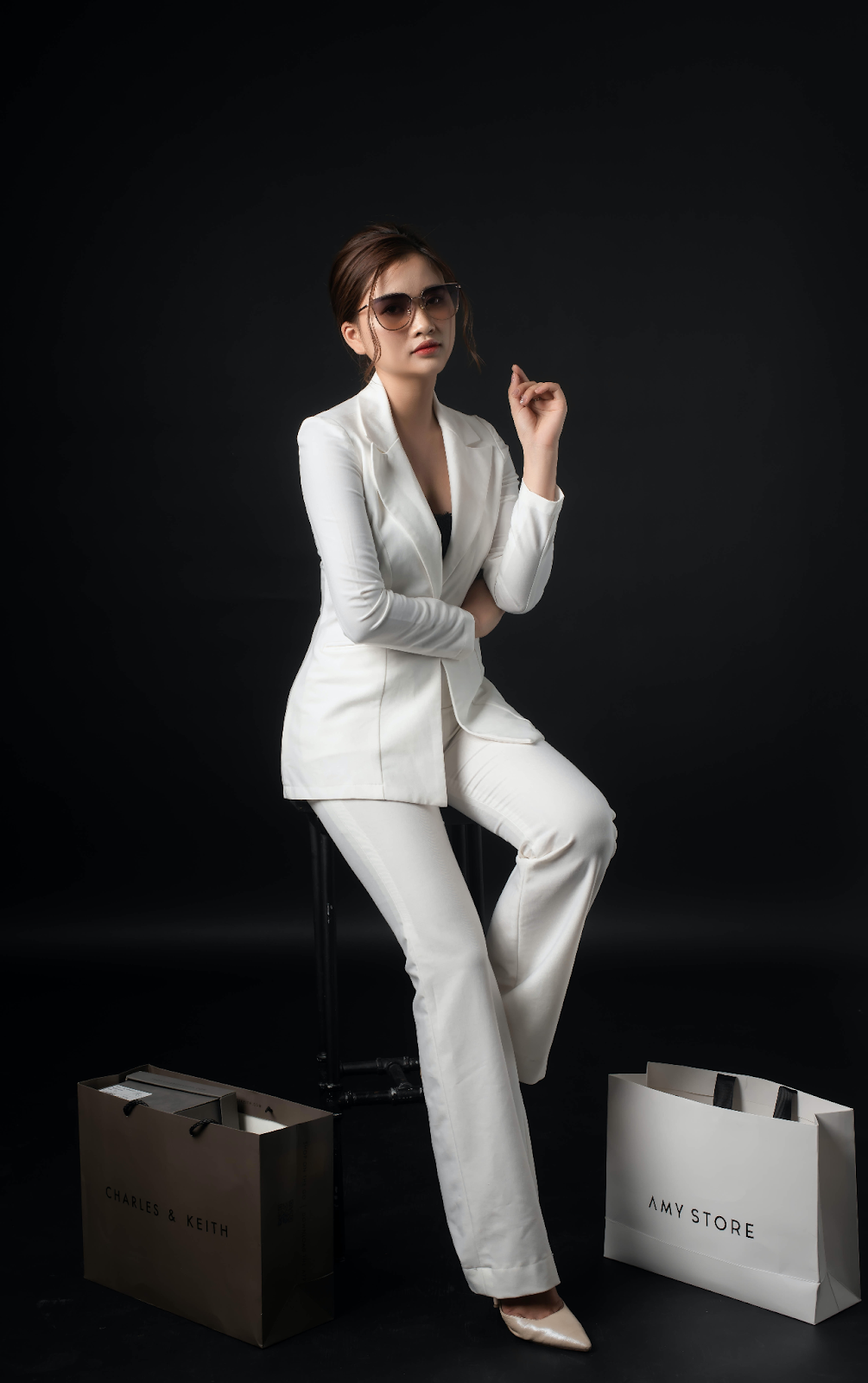 Girl posing in a white suit