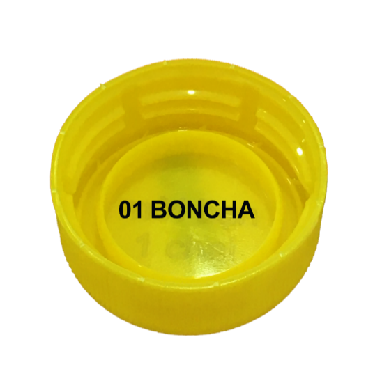 A yellow plastic bottle cap with black text

	Description automatically generated