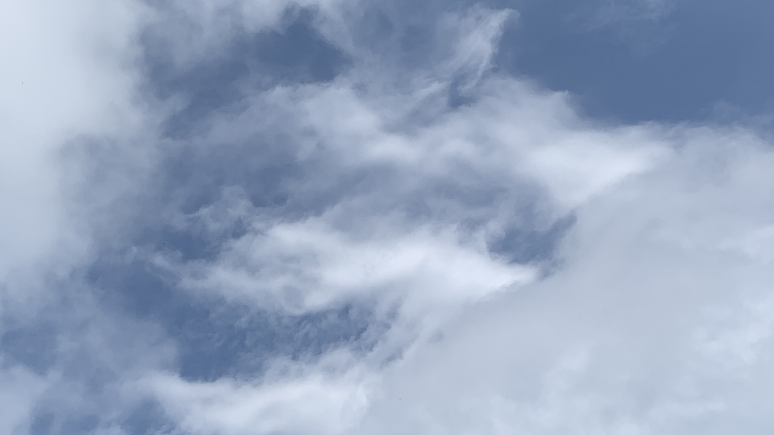 Mostly wispy clouds against a nice blue sky