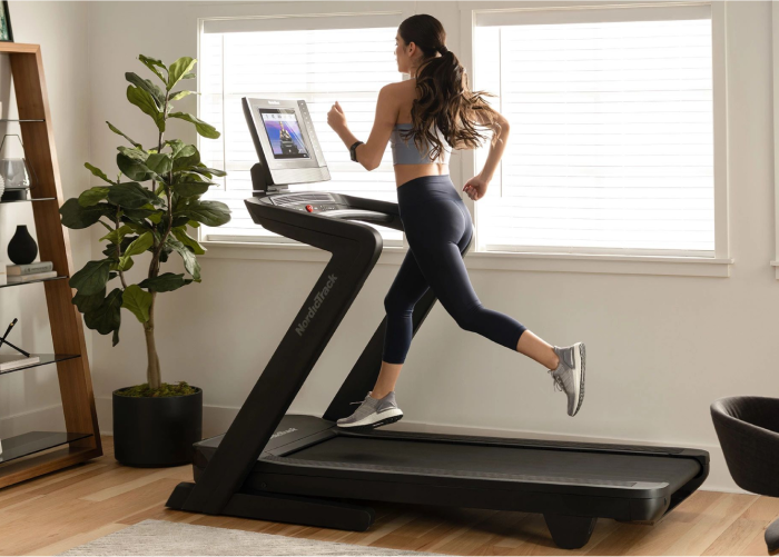 Woman Running on a Treadmill in an Article That Compares the Different NordicTrack Treadmill Models