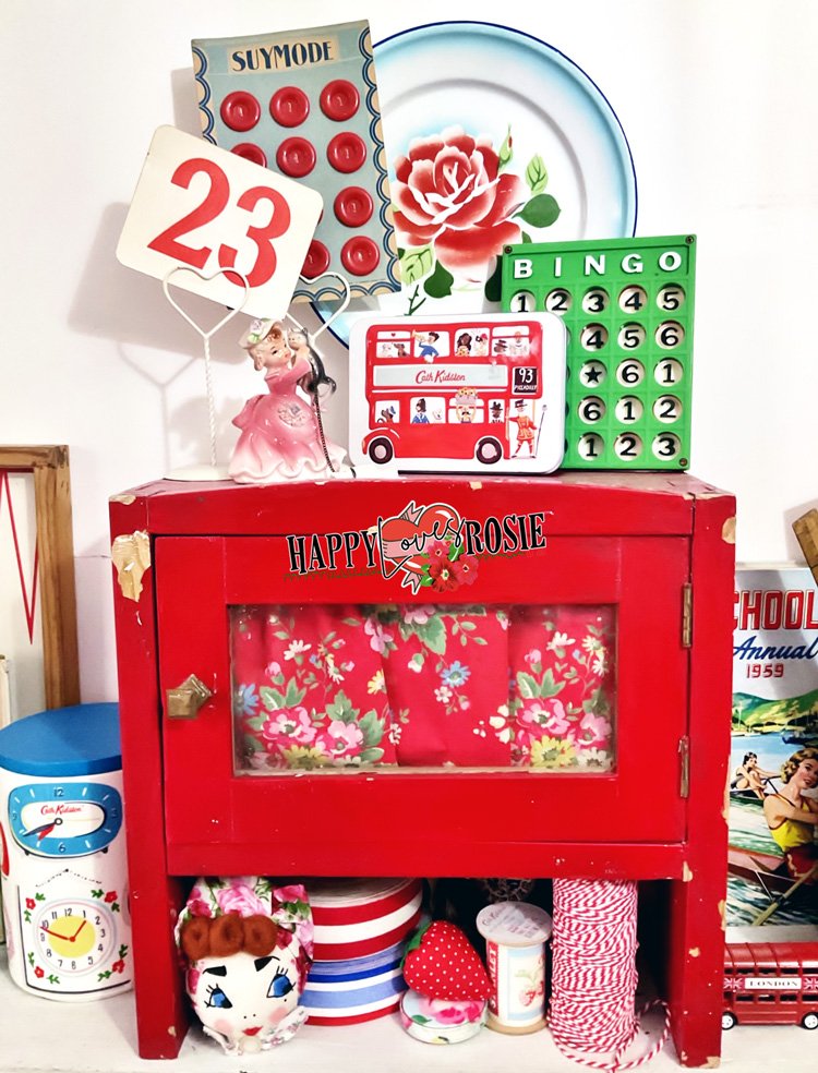 old red cupboard and bright kitsch collectables