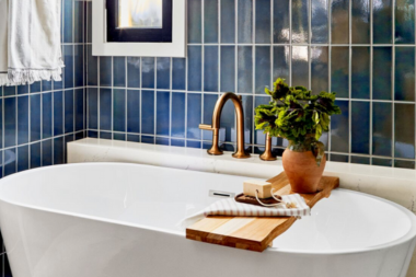 bold bathroom remodeling design with blue tile and bathtub custom built