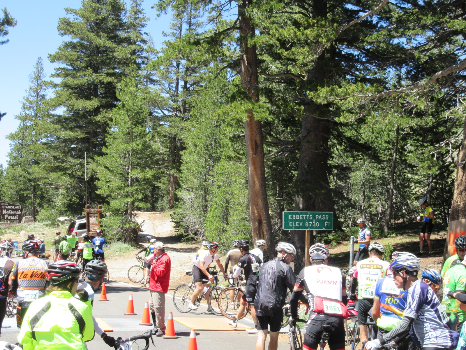 Cyclists congregate next to sign for Ebbetts Pass during the Death Ride