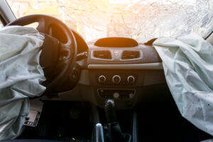 airbags deployed after a car accident from the steering wheel and passenger side