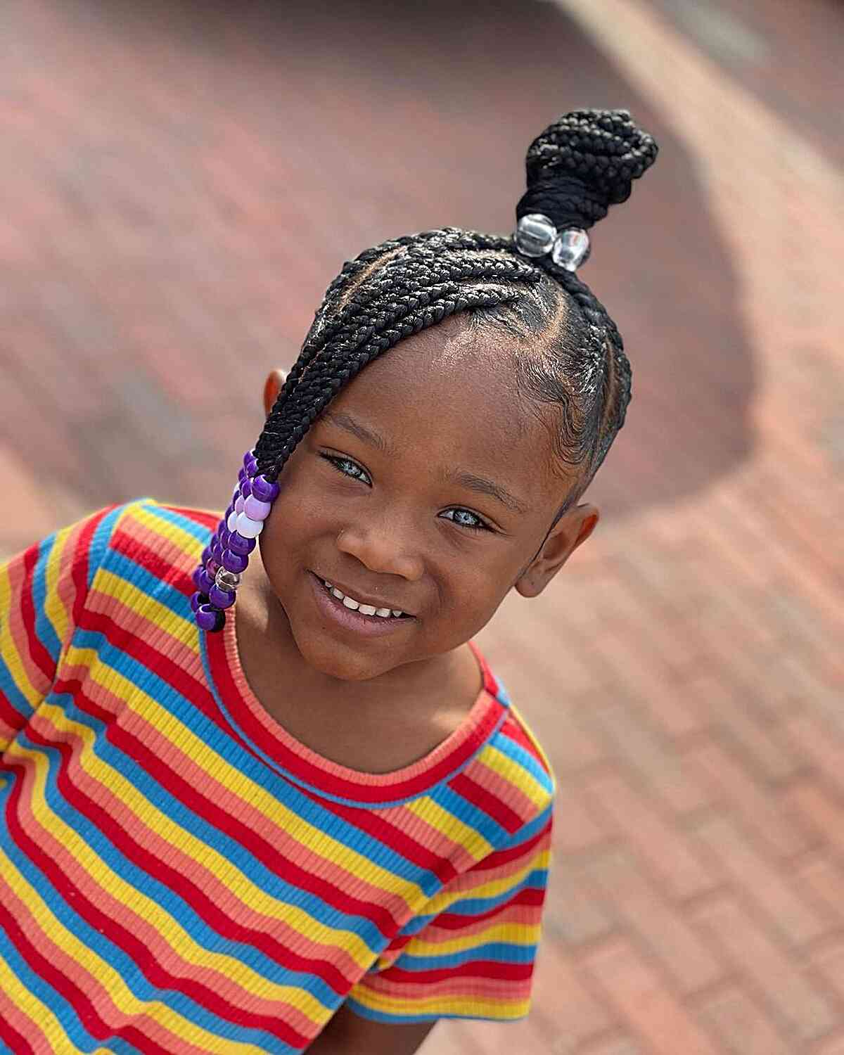Black girls hairstyle:  Picture of a little girl rocking braids with beads