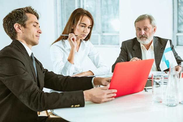 The business people working together at table.