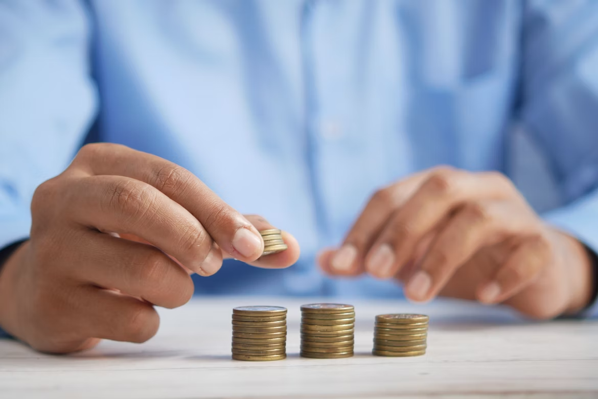 a man counting coins
