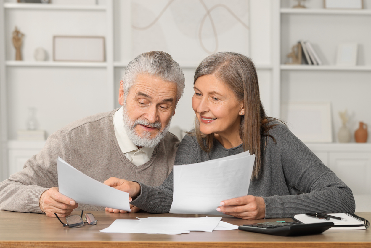 seniors looking over paperwork