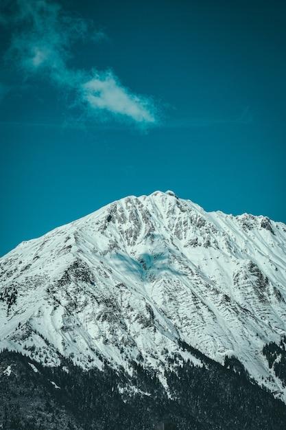 Free photo vertical shot of snow covered mountain peak