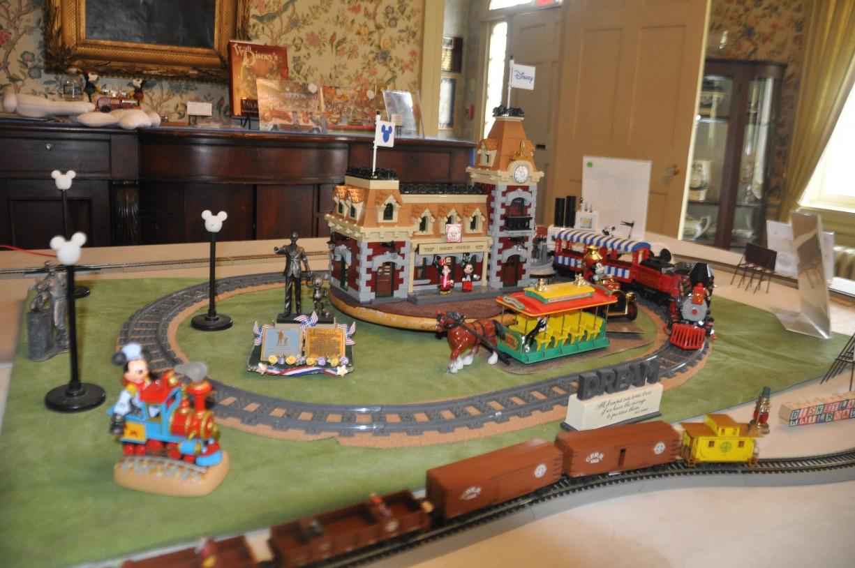 A toy train set on a table

Description automatically generated