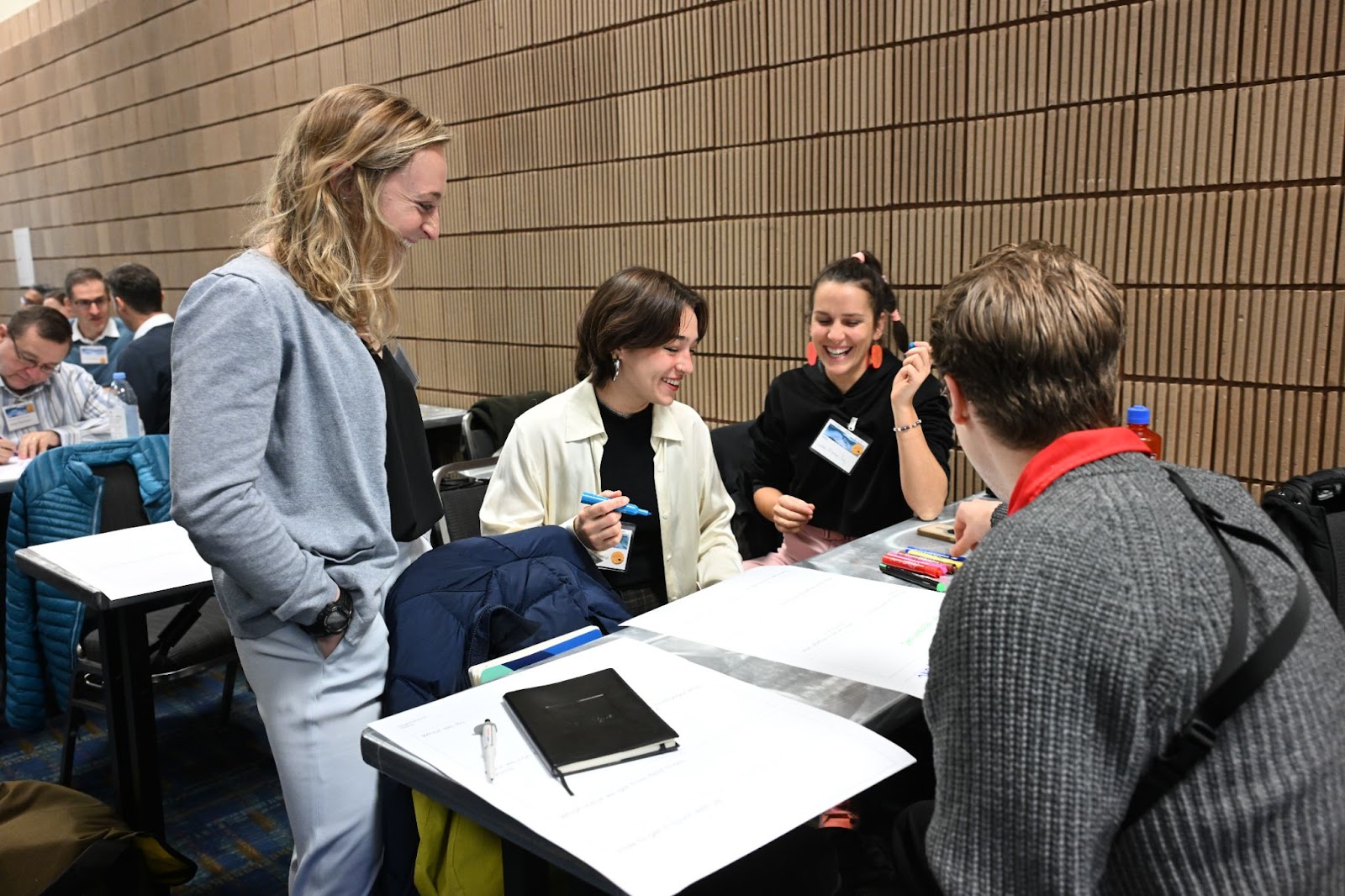 Four people in a group creating a plan to conduct, support, or inform field trials