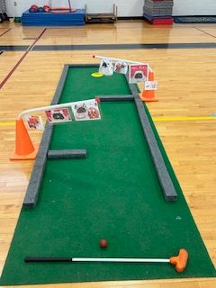 image of a mini golf lane set up in the gym