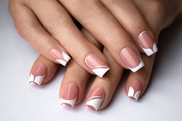 French manicure for women aged 50+ When retouching the photo, age-related changes in the skin were softened, but the main signs of age-related changes were preserved - wrinkles and some age spots characteristic of a person of an older age group nail art stock pictures, royalty-free photos & images
