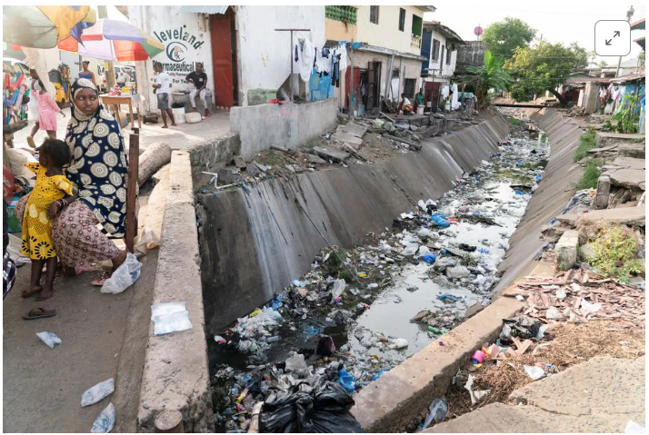 A drainage ditch with garbage in it

Description automatically generated with medium confidence