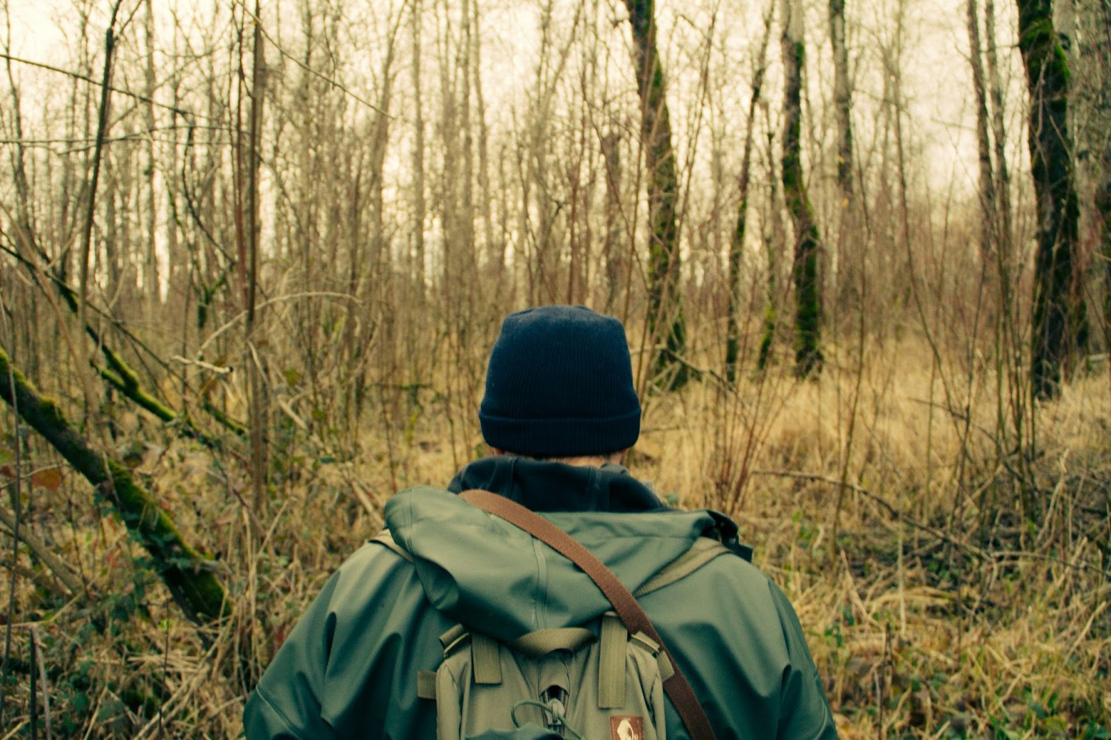 Prepping mindset, guy with a backpack in the forest