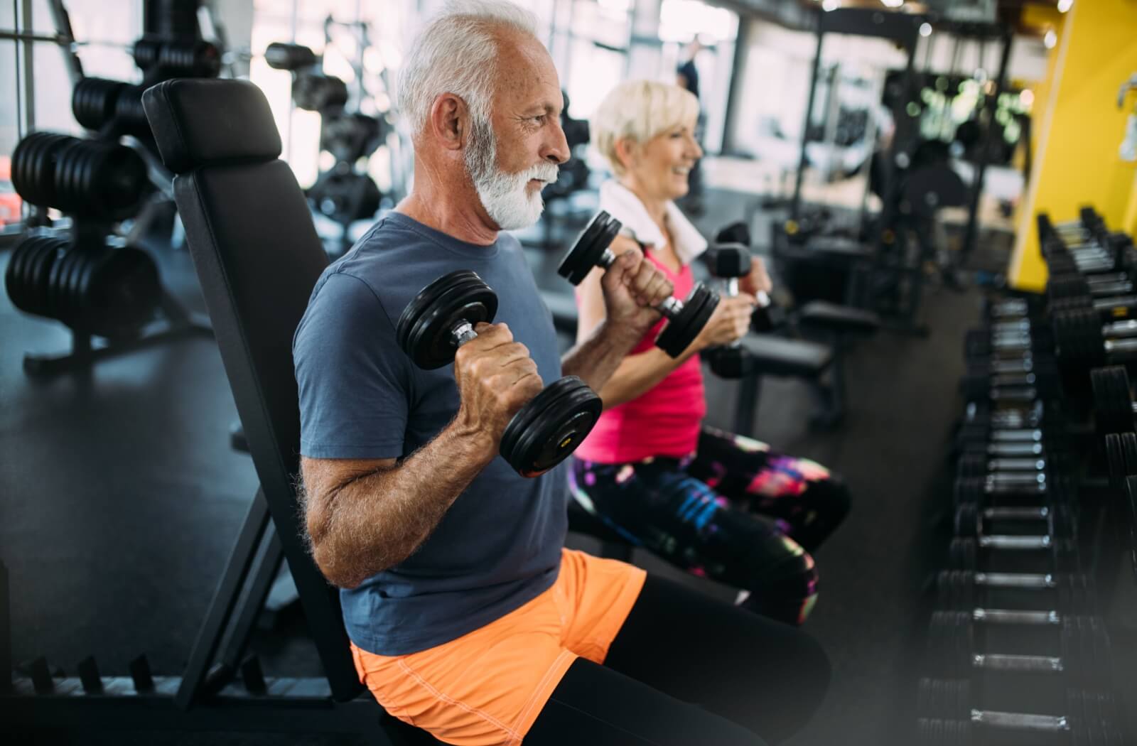 two seniors working out in the gym
