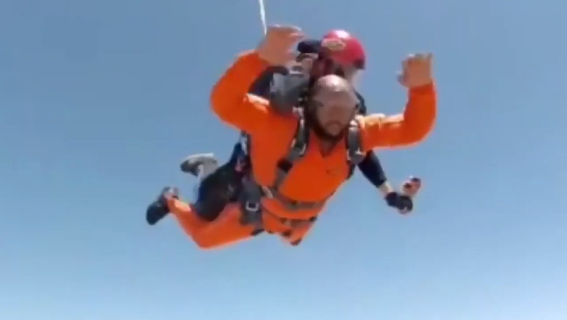 A couple of people skydiving

Description automatically generated with medium confidence