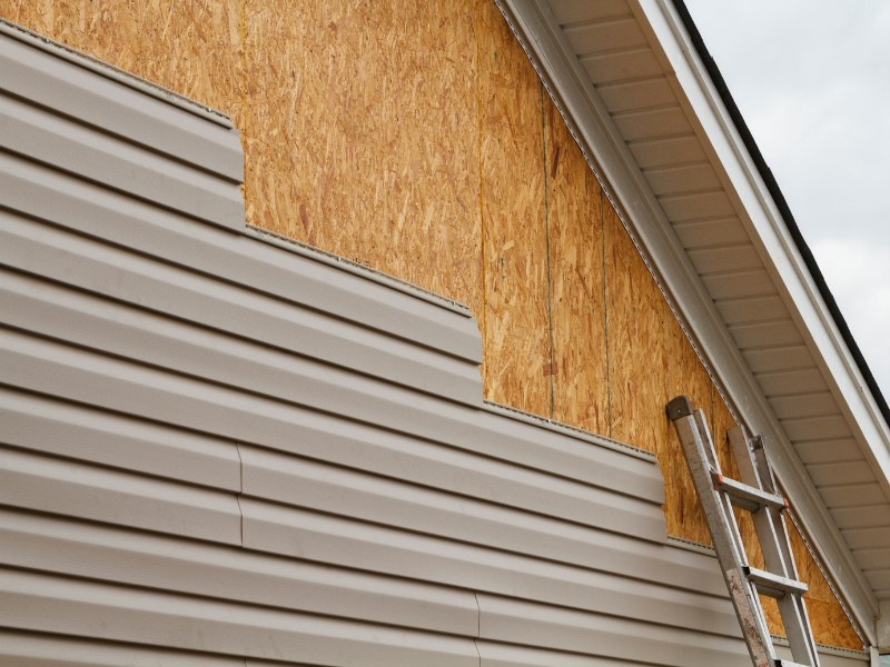 Installing new vinyl siding on a home