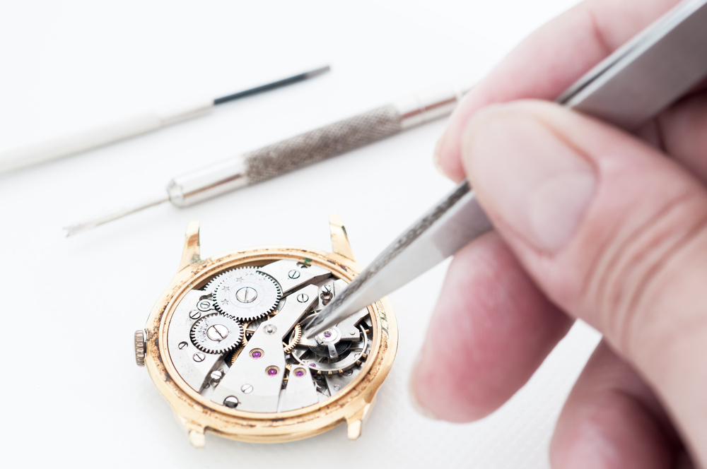 The careful process of luxury watch repair. 