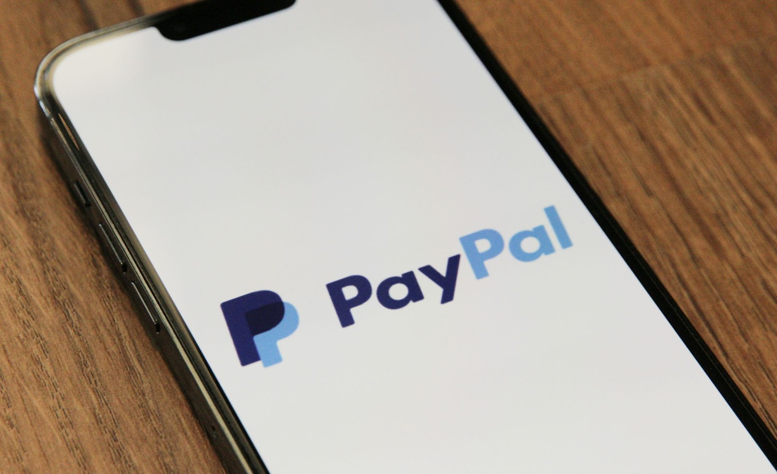 PayPal logo on the phone screen; beware of Facebook scams