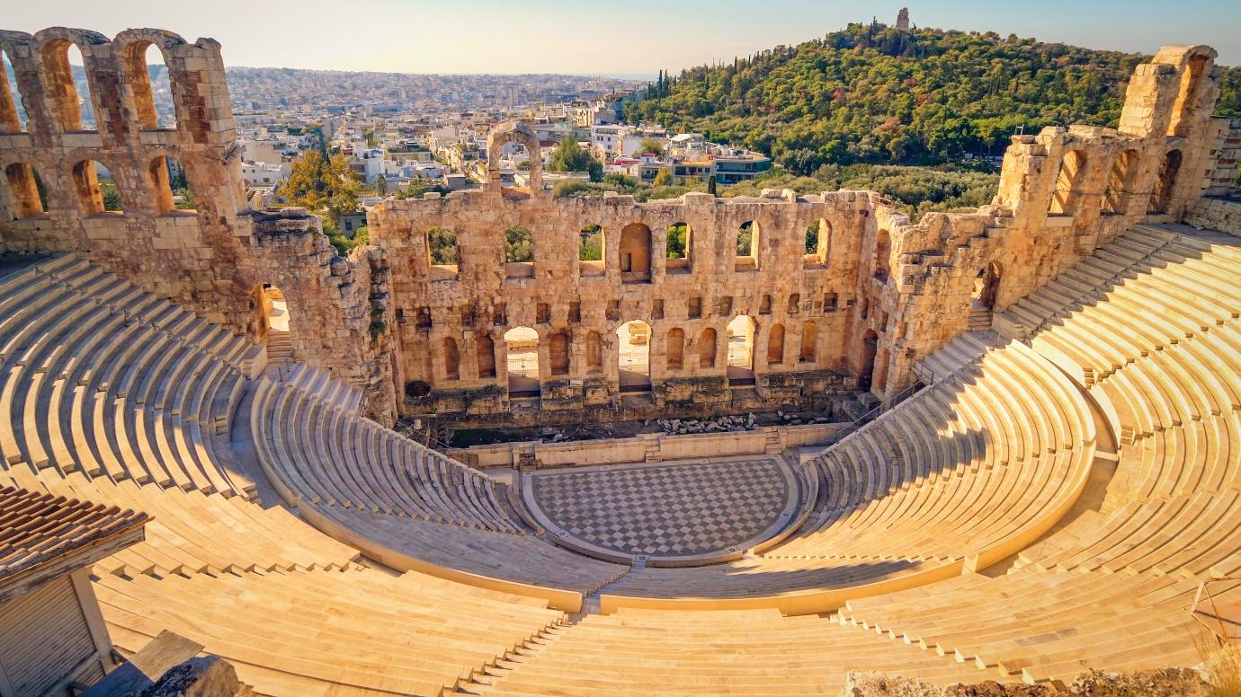 An old amphitheater with many windows

Description automatically generated