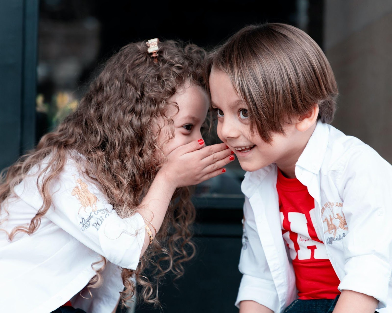 Kids whispering a secret