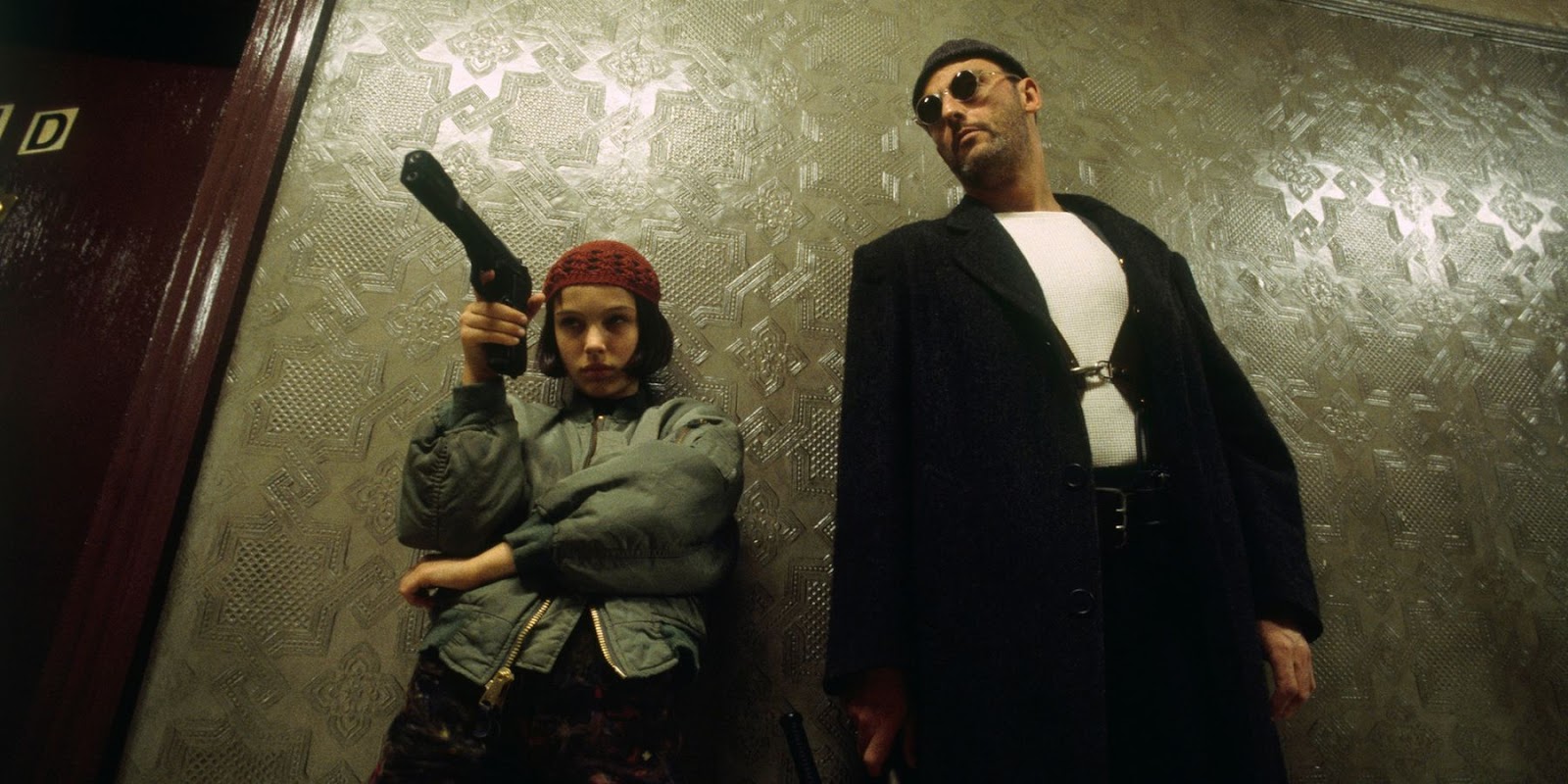 Leon teaching Mathilda how to use a gun in Leon the Professional