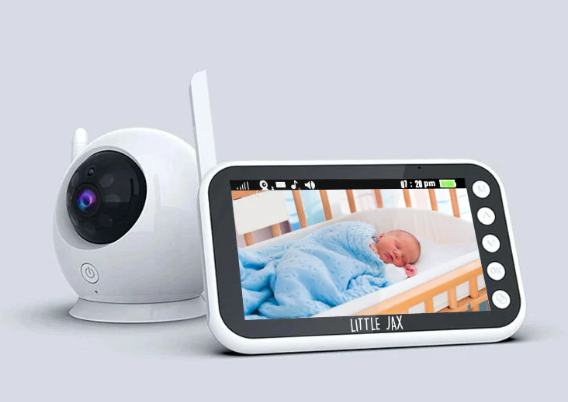 A baby monitor next to a camera

Description automatically generated