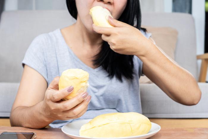 woman eating durian