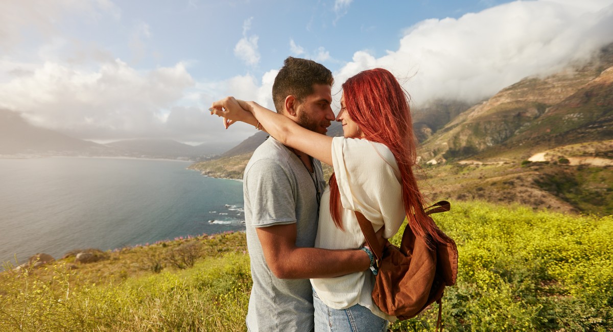 A romantic young couple hugging in Maui