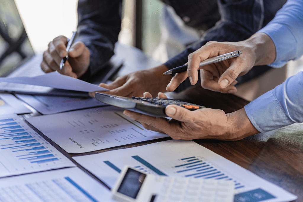 Certified Public Accountants Accounting services and International Air Transport Association (IATA) auditing on company charts and stock market data at Spirit Airlines office.