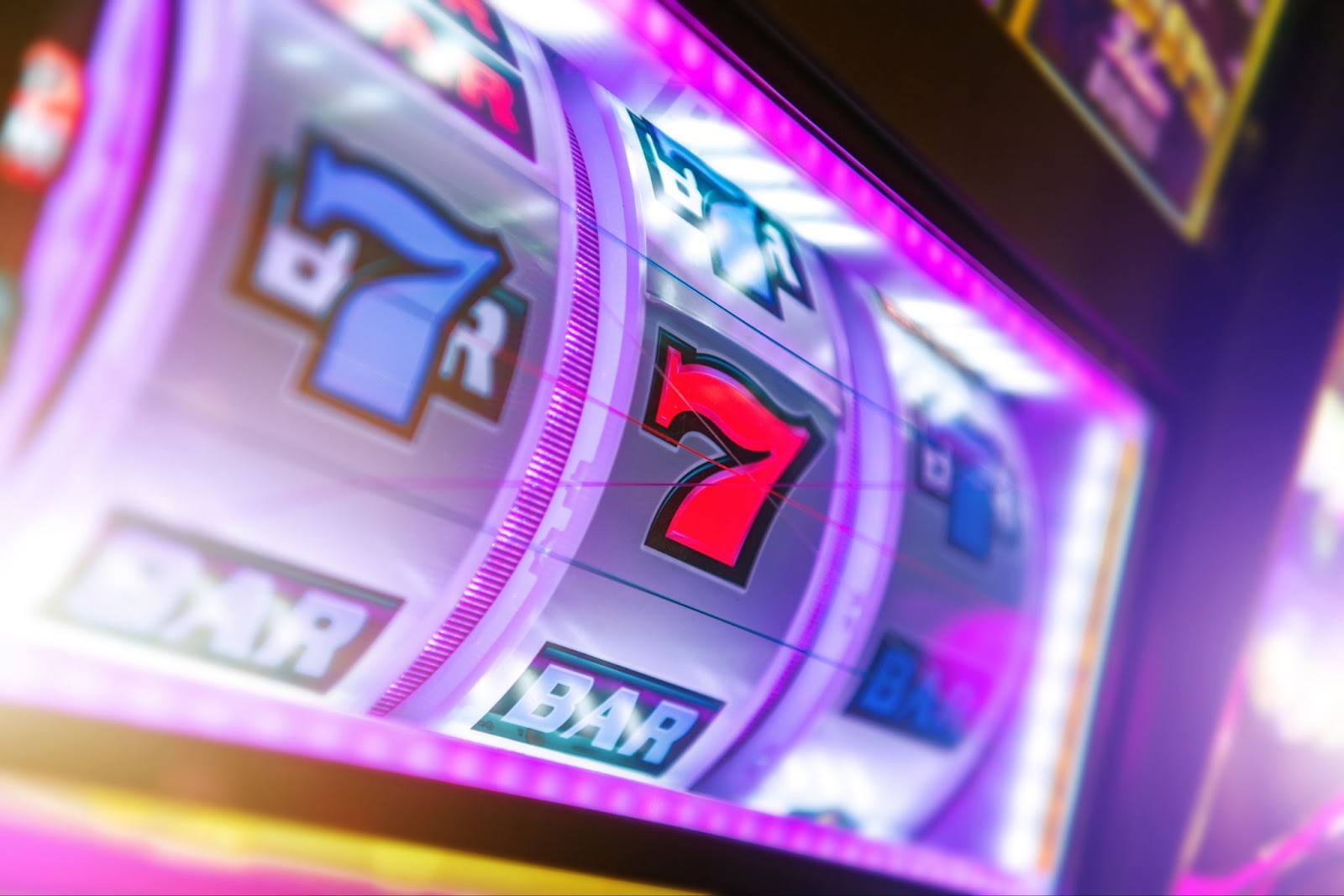 A vibrant close-up of a classic slot machine reel displaying the lucky number seven and bar symbols.