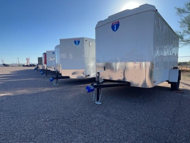 A row of trailers on the ground

Description automatically generated