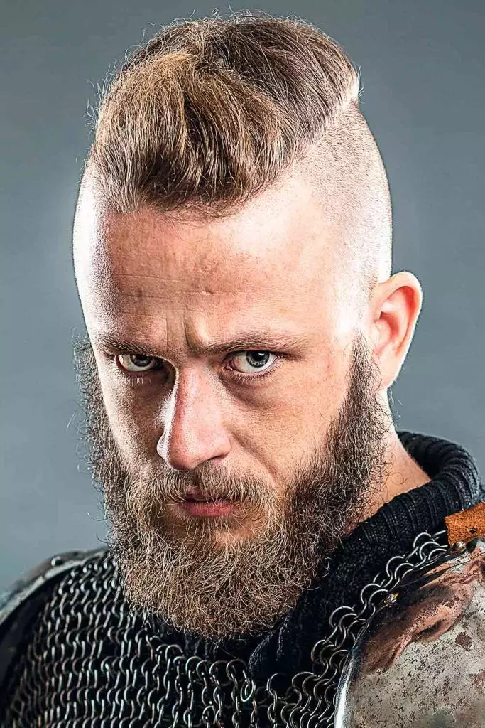 Picture showing Ragnar wearing one of his signature Viking hairstyles