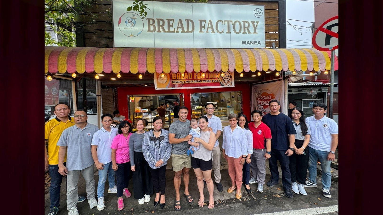 A group of people standing in front of a bakeryDescription automatically generated