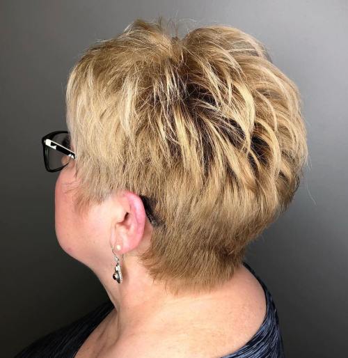 30 Best Short Hair For Older Women Over 60 With Glasses - 29. Blonde Hairstyle with Feathered Layers