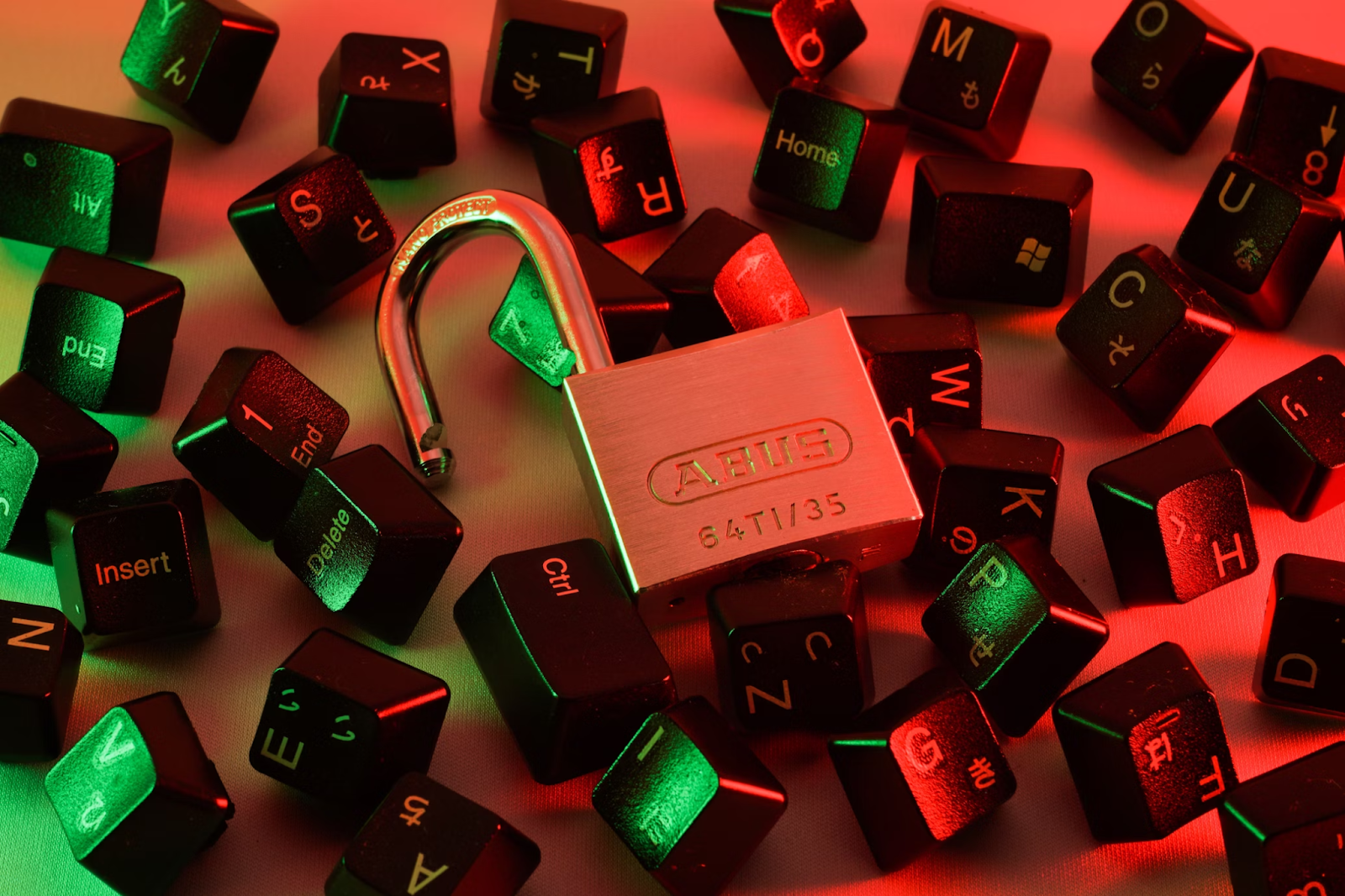 Red and black keyboard keycaps with a stainless steel padlock placed on top