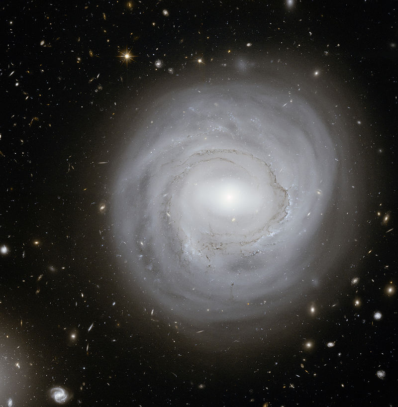 The pale spiral galaxy NGC 4921 as photographed by the Hubble Space Telescope.