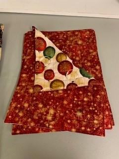 A stack of red and white cloth napkins

Description automatically generated