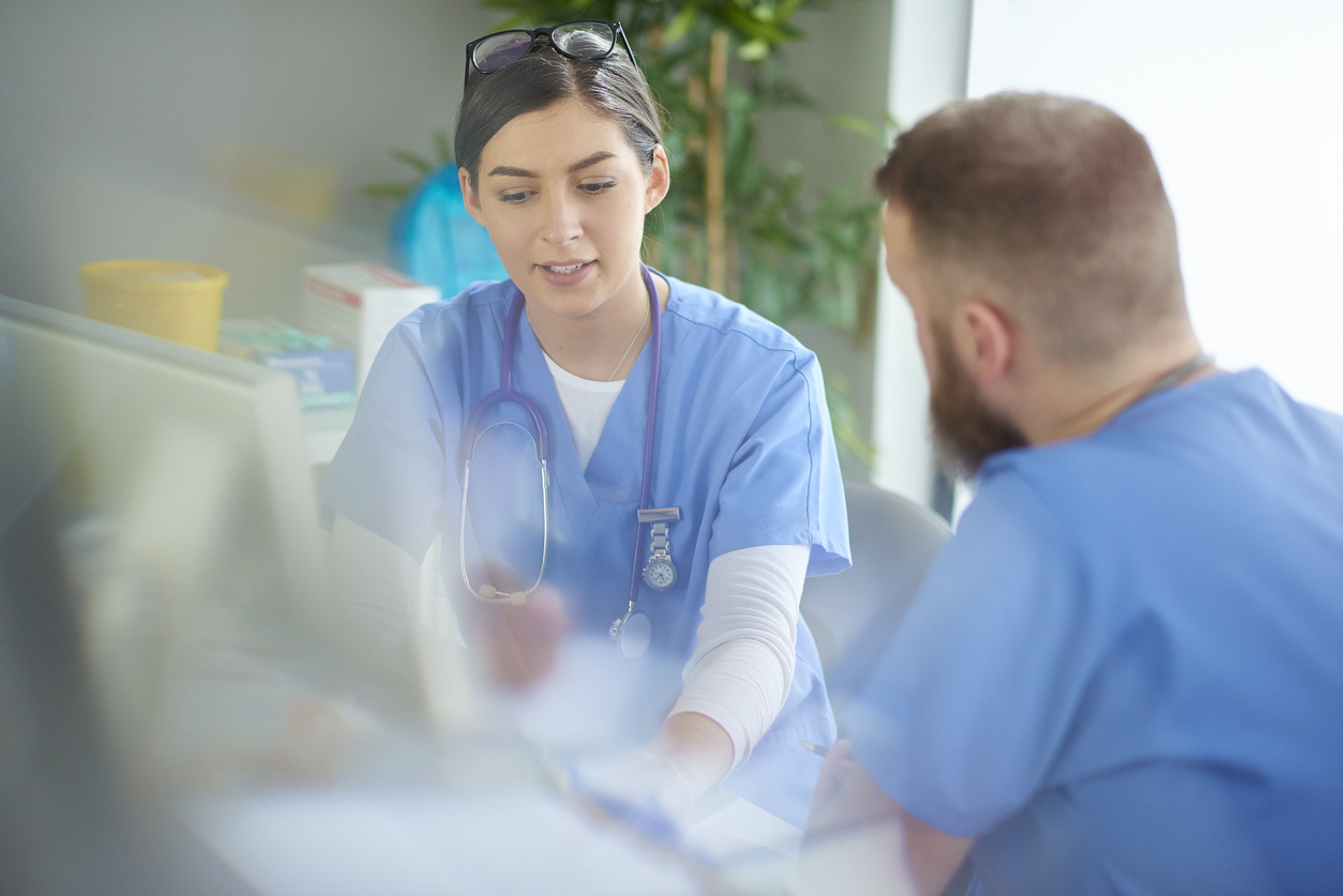 A doctor and patient discussing something

Description automatically generated